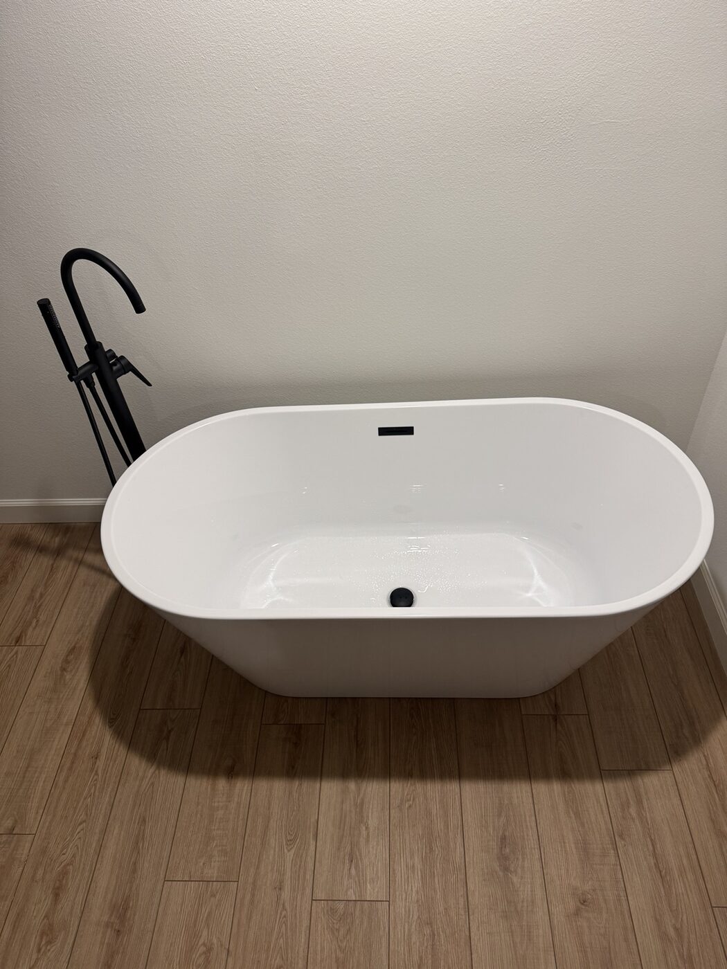 Completed freestanding tub and plumbing fixtures