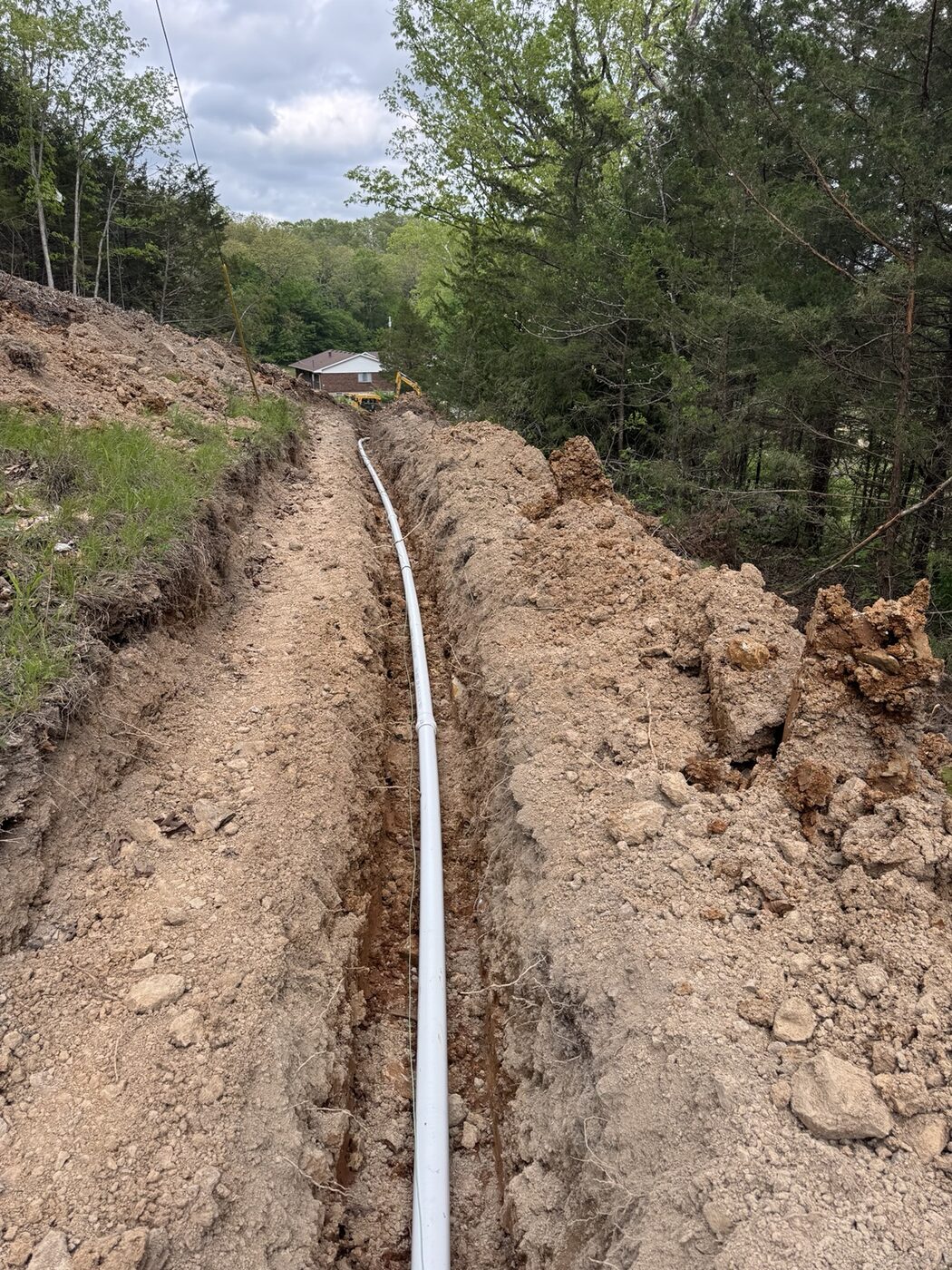 Sewer line installed in an excavated trench