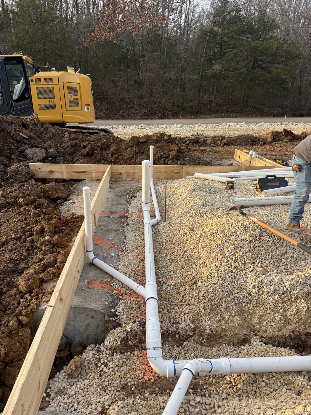Underground plumbing installation at a construction site